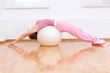 canvas print picture - Woman doing stretching exercise on ball