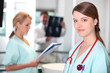 Young female nurse in X-ray room.