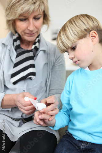 Photo: Grandmother healing her grandson's finger Grandmother healing her grandson's finger