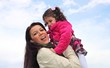 Foto: Mother embracing her daughter Mother embracing her daughter