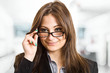 Woman holding eyeglasses Woman holding eyeglasses