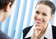 Businesspeople, or businesswoman and client