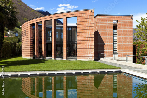 Photo: modern bricks house, surrounded by nature modern bricks house, surrounded by nature