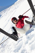 Photo: Female Skier Sitting In Snow With After Fall Female Skier Sitting In Snow With After Fall