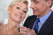Mature couple drinking champagne