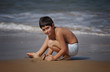 boy playing on the beach