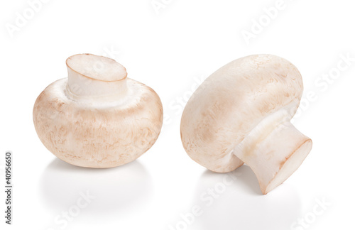 Photo: Fresh Mushrooms champignon Isolated on a white background Fresh Mushrooms champignon Isolated on a white background