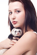 Girl with polecat isolated on white background