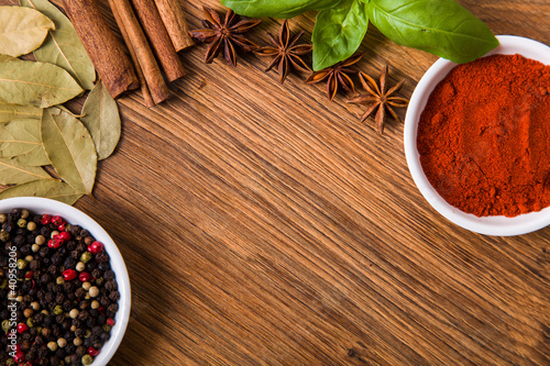 Photo: Frame composition spices on wood, anise,cinnamon, laurel Frame composition spices on wood, anise,cinnamon, laurel