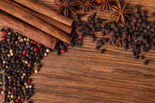 Photo: Frame composition of spices on wood,anise,cinnamon,laurel Frame composition of spices on wood,anise,cinnamon,laurel