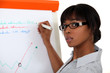 Young woman writing on a paperboard