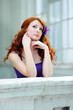 Young woman portrait with flower in her hair.