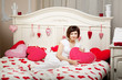 Woman in bed with hearts