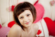 Woman in bed with hearts