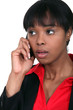An African American businesswoman getting bad news.