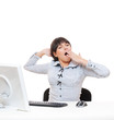 studio shot of tired businesswoman yawning on her workplace