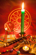 Tarot cards with a magic ball, wand illuminated by candlelight