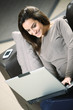 Young Woman on Couch with Laptop