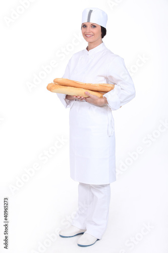Photo: Baker with loaves of bread Baker with loaves of bread