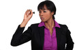 Businesswoman throwing dart