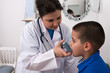 Little boy with asthma using nebuliser at clinic