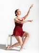 Ballet dancer posing on studio background Ballet dancer posing on studio background