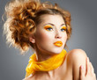 Beautiful woman with bright yellow makeup and curly hairstyle