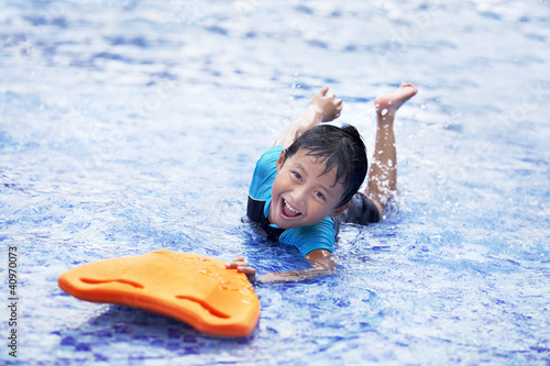 Photo: Happy Asian kid at swimming pool Happy Asian kid at swimming pool