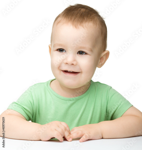 Photo: Portrait of a cute cheerful little boy Portrait of a cute cheerful little boy