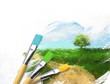 Foto: Artist brushes with a half finished painted landscape canvas Artist brushes with a half finished painted landscape canvas