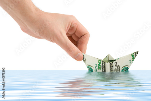 Photo: Hand launching money ship Hand launching money ship