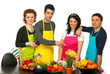 Cheerful team of chefs pointing