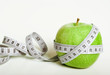 Fersh green apple with measuring tape
