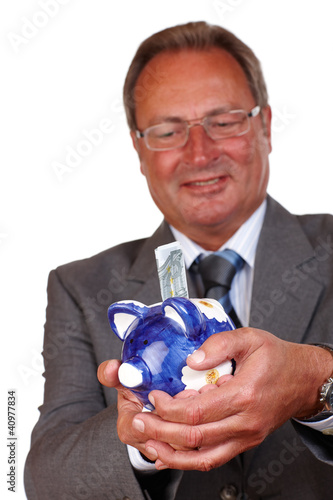 Foto: Mann mit Geld und Sparschwein Mann mit Geld und Sparschwein