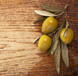 Olives over Wooden Background. With sample text Olives over Wooden Background. With sample text