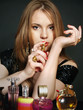 Foto: attractive sexy young woman choosing perfumery aromas attractive sexy young woman choosing perfumery aromas
