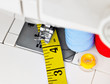 Sewing machine, mesuring tape and reels Sewing machine, mesuring tape and reels