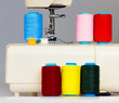 Sewing machine and a set of reels with thread Sewing machine and a set of reels with thread