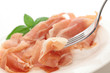 Uncured ham on fork