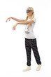 Sleepwalking blonde girl in pajamas on white background
