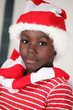 Christmas boy a cute african child in Santa cap