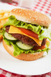 Classic hamburger with cheese, tomato and lettuce Classic hamburger with cheese, tomato and lettuce