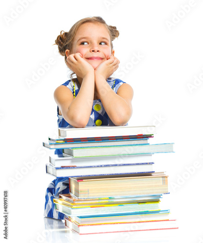 Photo: Education - funny girl with books. Education - funny girl with books.