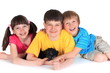 Happy siblings with puppy
