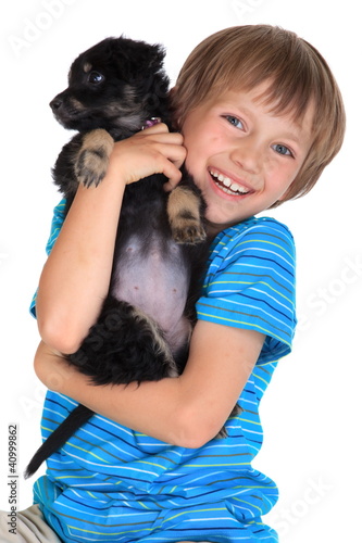 Photo: Happy young boy with pet dog Happy young boy with pet dog