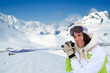 Portrait of woman at the mountain in ski outfit