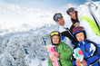 Family of four people at the mountain in winter