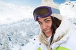 Portrait of woman at the mountain in ski outfit