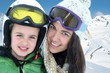 Mother and daughter skiing in the mountain