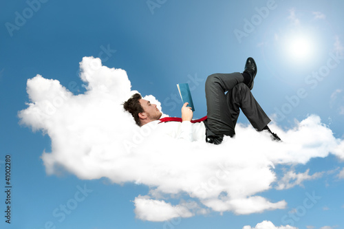 Photo: Businessman is reading a book Businessman is reading a book